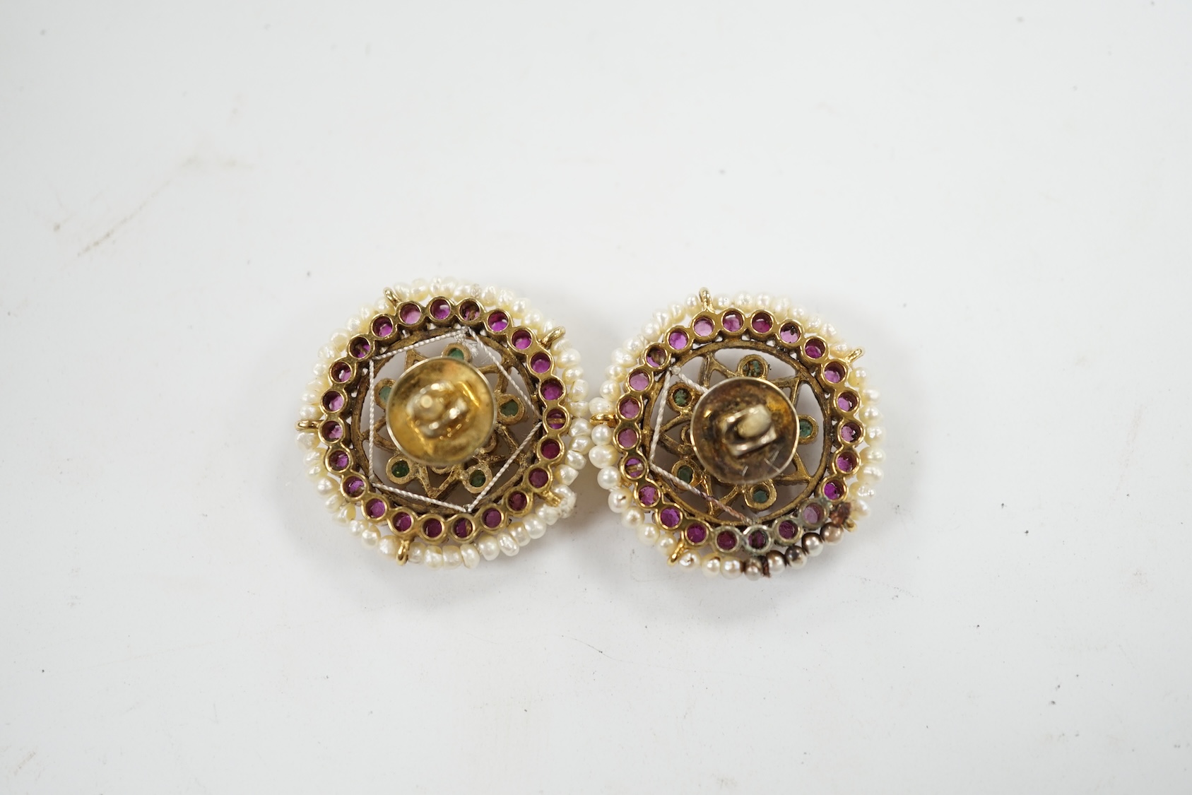 A pair of 20th century Indian yellow metal and multi gem set disc shaped earrings, 22mm. Condition - fair